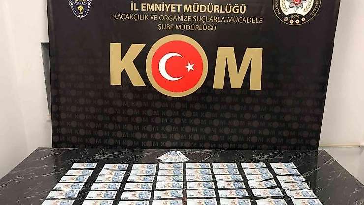 Kütahya'da piyasaya sahte para süren iki kişi yakalandı